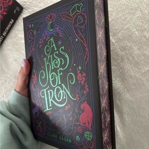 A Kiss of Iron Book with Black and Green Cover